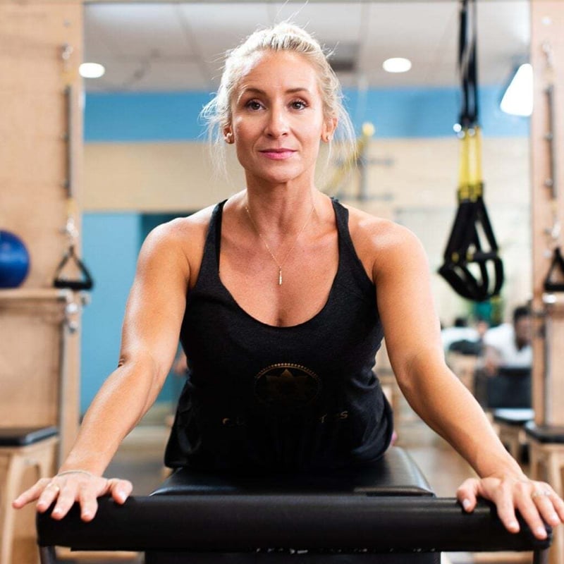 Understand the Basics of Pilates - member at Club Pilates doing Pilates
