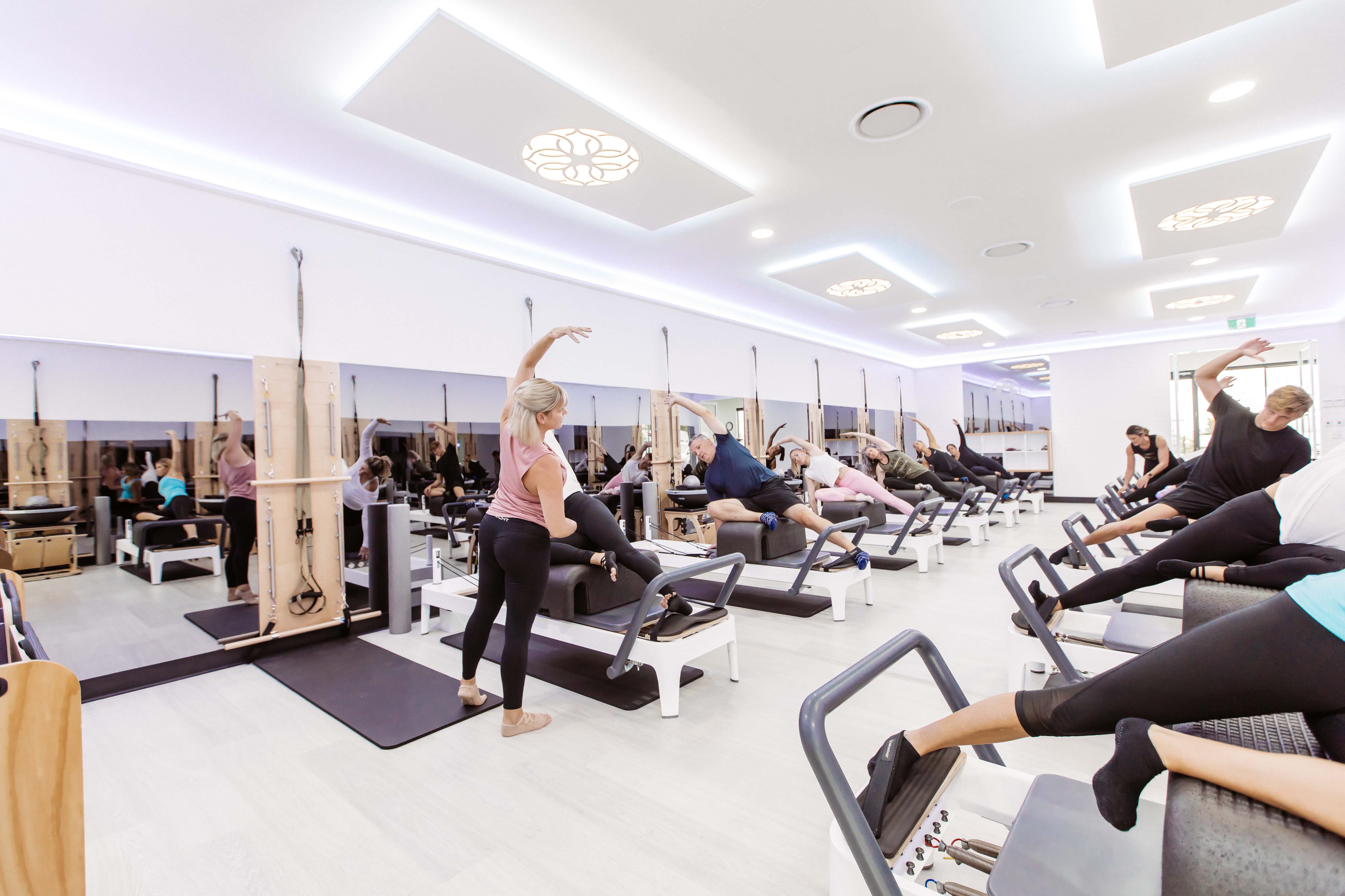 woman performing a modified Pilates exercise while injured