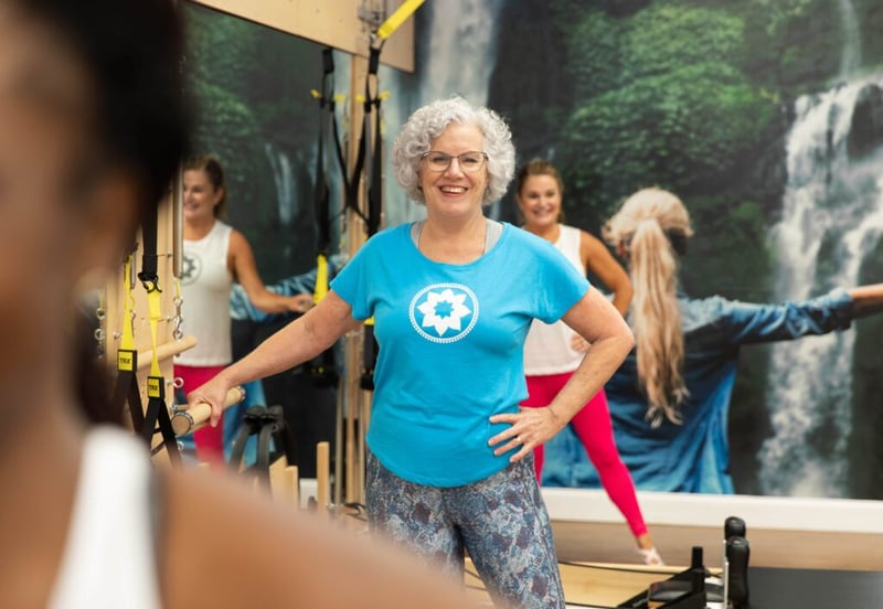 Pilates for arthritis - elder woman working out at Club Pilates