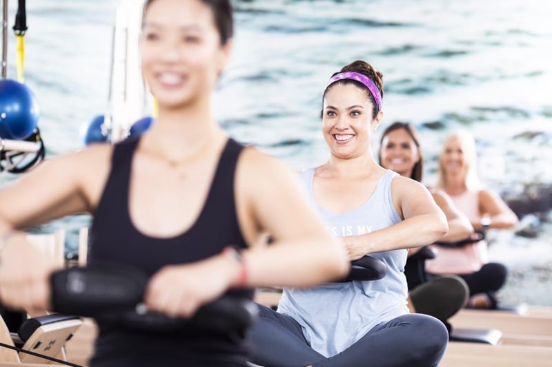 Pilates and Meditation - women doing controlled movements in a Pilates class