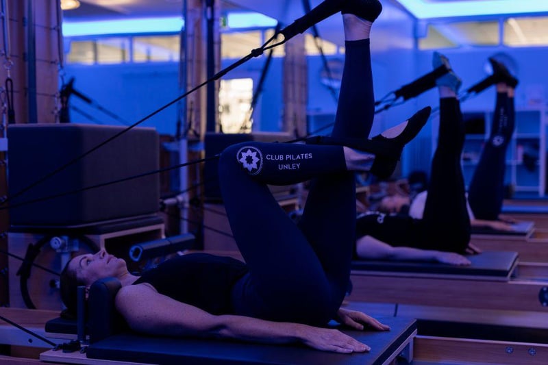 Pilates Core: How a Stronger Core Improves Daily Living - Club Pilates member on reformer