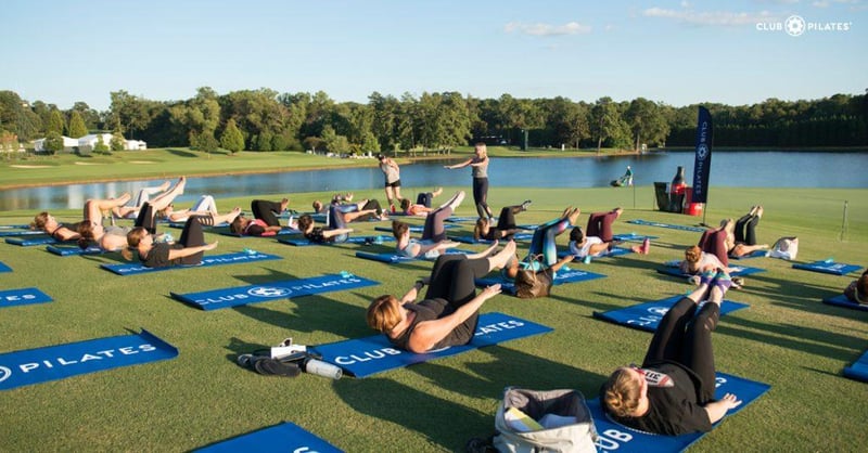 Why Vitamin D is Important for Exercising - women and men doing Pilates outside