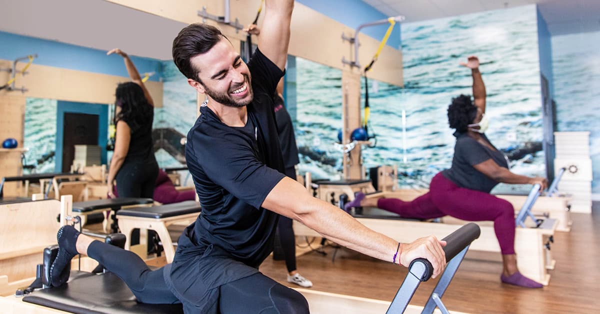 Wearing man wearing shorts and leggings to pilates class