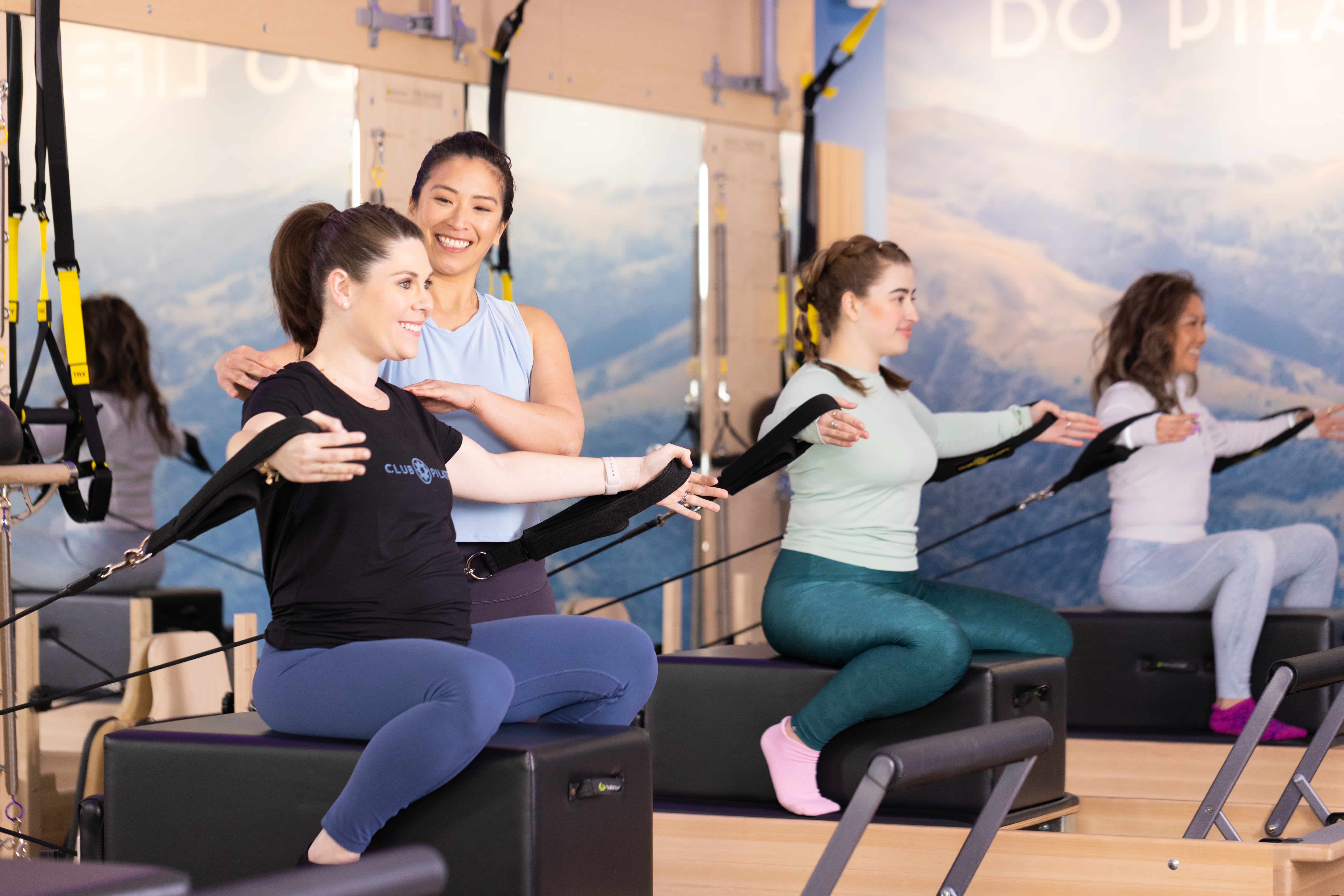 Student using arm straps in a Perth Pilates Studio